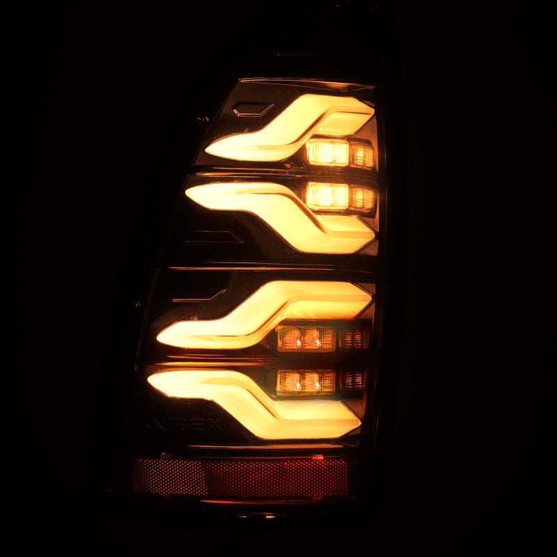 AlphaRex 05-15 Toyota Tacoma LUXX LED Taillights Alpha Blk w/Activ Light/Seq Signal 680050 *Discontinued